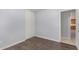Bedroom with mirrored closet doors and wood laminate flooring at 2440 W Bloch Rd, Phoenix, AZ 85041