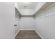Spacious walk in closet with double rods and wood laminate flooring at 2440 W Bloch Rd, Phoenix, AZ 85041
