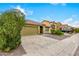 House exterior with a green garage door and desert landscaping at 2440 W Bloch Rd, Phoenix, AZ 85041