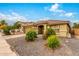 Single-story home with a landscaped front yard and two-car garage at 2440 W Bloch Rd, Phoenix, AZ 85041