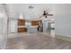 Modern kitchen with stainless steel appliances and an adjacent dining area at 2440 W Bloch Rd, Phoenix, AZ 85041