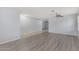 Open living area with wood-look floors and neutral walls at 2440 W Bloch Rd, Phoenix, AZ 85041