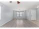 Living room with wood-look floors and a neutral color palette at 2440 W Bloch Rd, Phoenix, AZ 85041