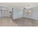 Spacious living room featuring wood-look floors and soft blue walls at 2440 W Bloch Rd, Phoenix, AZ 85041