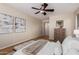 Spacious bedroom with hardwood floors and large artwork at 2475 N 163Rd Dr, Goodyear, AZ 85395