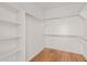 Large walk-in closet with ample shelving and hanging space at 2475 N 163Rd Dr, Goodyear, AZ 85395