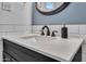 Modern bathroom vanity with white countertop and dark cabinets at 2720 W Libby St, Phoenix, AZ 85053