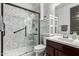 Bathroom with walk-in shower, modern vanity, and dark wood cabinets at 4486 S Montana Dr, Chandler, AZ 85248