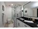 Elegant bathroom with marble shower and dark vanity at 5245 N 25Th St, Phoenix, AZ 85016