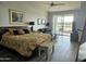 Main bedroom with lake views and access to a patio at 10503 E Sunnydale Dr, Sun Lakes, AZ 85248