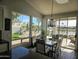 Kitchen dining area with lake view and sliding glass doors at 10503 E Sunnydale Dr, Sun Lakes, AZ 85248