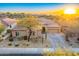 One-story home with a desert landscape and driveway at 11157 E Greenway Rd, Scottsdale, AZ 85255
