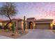 One-story home with a desert landscape and driveway at 11157 E Greenway Rd, Scottsdale, AZ 85255