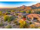 Aerial view of community with homes, pools, and mountain views at 11157 E Greenway Rd, Scottsdale, AZ 85255