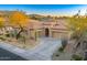 One-story home with a desert landscape and driveway at 11157 E Greenway Rd, Scottsdale, AZ 85255