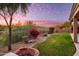 Landscaped backyard with firepit and a gorgeous sunset view at 11157 E Greenway Rd, Scottsdale, AZ 85255