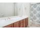Bathroom with dual vanity and shower/tub combo at 11157 E Greenway Rd, Scottsdale, AZ 85255