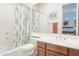 Bathroom with shower/tub combo, dual vanity, and toilet at 11157 E Greenway Rd, Scottsdale, AZ 85255