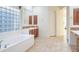 Spa-like bathroom with soaking tub and walk-in shower at 11157 E Greenway Rd, Scottsdale, AZ 85255
