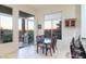 Bright dining area with glass table and chairs, adjacent to patio access at 11157 E Greenway Rd, Scottsdale, AZ 85255