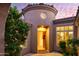 Elegant entryway with arched doorway and courtyard fountain at 11157 E Greenway Rd, Scottsdale, AZ 85255