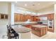 Open kitchen boasts granite countertops, stainless steel appliances, and a large island at 11157 E Greenway Rd, Scottsdale, AZ 85255