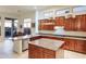 Island kitchen with granite counters, stainless steel appliances and view to backyard at 11157 E Greenway Rd, Scottsdale, AZ 85255