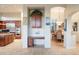 Open kitchen features granite countertops, stainless steel appliances, and built-in desk at 11157 E Greenway Rd, Scottsdale, AZ 85255
