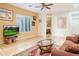 Living room features hardwood floors and large windows at 11157 E Greenway Rd, Scottsdale, AZ 85255