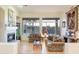 Spacious living room featuring a fireplace and ample natural light at 11157 E Greenway Rd, Scottsdale, AZ 85255