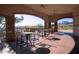 Community patio with tables and chairs near the pool at 11157 E Greenway Rd, Scottsdale, AZ 85255