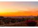 Stunning sunset view overlooking a city skyline and mountain range at 11157 E Greenway Rd, Scottsdale, AZ 85255