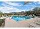 Community swimming pool with lounge chairs and mountain backdrop at 11157 E Greenway Rd, Scottsdale, AZ 85255