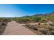 Paved walking path with desert landscape and mountain views at 11157 E Greenway Rd, Scottsdale, AZ 85255