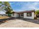 Charming single-story home featuring a red tile roof, spacious front yard and large driveway at 113 W Bowker St, Phoenix, AZ 85041