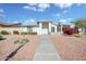 Single-story home with landscaped yard and walkway at 13624 W Aleppo Dr, Sun City West, AZ 85375