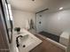Updated bathroom with double vanity and walk-in shower at 1745 E Glade Ave, Mesa, AZ 85204