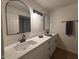 Modern bathroom with double vanity and updated fixtures at 1745 E Glade Ave, Mesa, AZ 85204