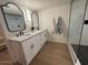 Updated bathroom with double vanity and walk-in shower at 1745 E Glade Ave, Mesa, AZ 85204