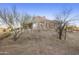 Tan stucco house with large windows and desert landscaping at 28819 N 151St St, Scottsdale, AZ 85262