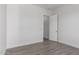 Bright bedroom with grey flooring and an open door at 2917 N Katie Ln, Litchfield Park, AZ 85340