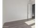 Spacious bedroom with grey flooring and an open door at 2917 N Katie Ln, Litchfield Park, AZ 85340