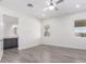 Bright bedroom with ceiling fan and wood-look flooring at 2917 N Katie Ln, Litchfield Park, AZ 85340