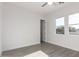 Bright bedroom with wood-look floors and an additional door at 2917 N Katie Ln, Litchfield Park, AZ 85340