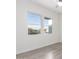 Bright bedroom with two large windows and wood-look floors at 2917 N Katie Ln, Litchfield Park, AZ 85340