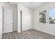 Spacious bedroom with sliding door closet and wood-look floors at 2917 N Katie Ln, Litchfield Park, AZ 85340