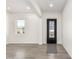 Bright and airy entryway with gray wood-look flooring at 2917 N Katie Ln, Litchfield Park, AZ 85340