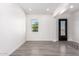 Bright and airy entryway with gray wood-look flooring at 2917 N Katie Ln, Litchfield Park, AZ 85340