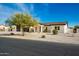 New construction home with a modern design, featuring a large driveway and two-car garage at 2917 N Katie Ln, Litchfield Park, AZ 85340