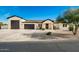 New construction home with a modern design, featuring a large driveway and two-car garage at 2917 N Katie Ln, Litchfield Park, AZ 85340